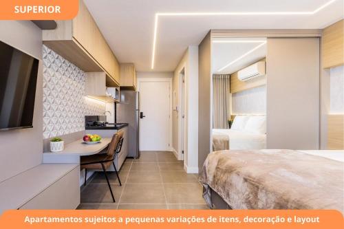 a hotel room with a bed and a desk at GO Carlos Gomes by My Way in Porto Alegre