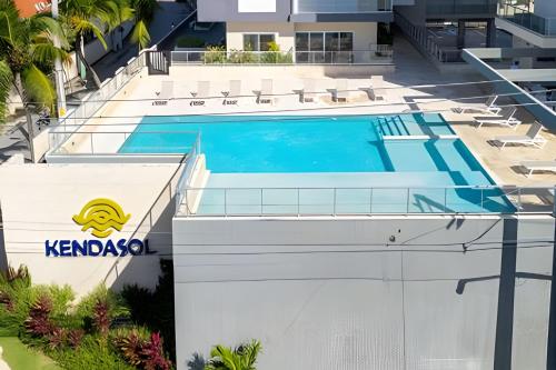 an aerial view of a building with a swimming pool at Caribbean Nature Sourrounded Refuge Apartment in Juan Dolio