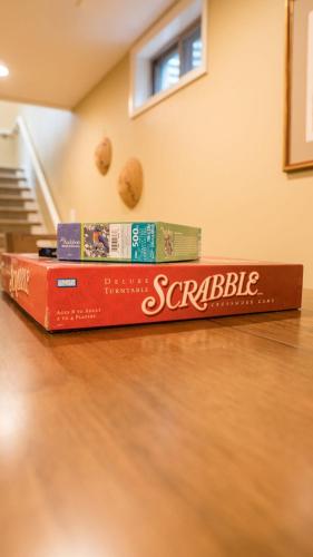a stack of books sitting on top of a table at Audubon Acres l pool table & outdoor dining in Benton Harbor