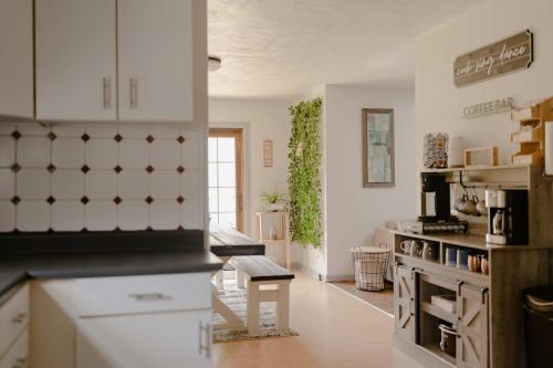 a kitchen with white cabinets and a counter top at Kevins Place near PawPaw Lake in Watervliet
