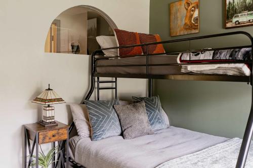a bedroom with two bunk beds and a bed at Kevins Place near PawPaw Lake in Watervliet