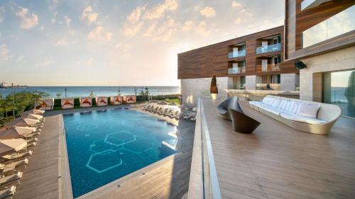 a hotel with a swimming pool on a balcony at Crowne Plaza Florya Istanbul by IHG in Istanbul