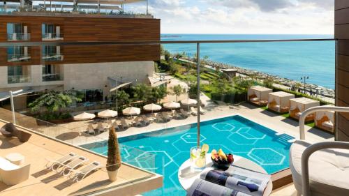 a view of the pool and ocean from the balcony of a hotel at Crowne Plaza Florya Istanbul by IHG in Istanbul