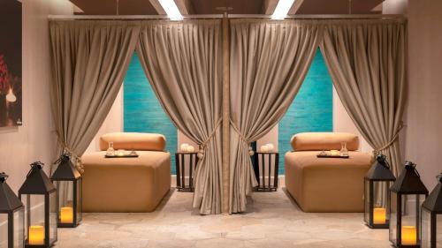 a room with two beds and two windows at Crowne Plaza Florya Istanbul by IHG in Istanbul