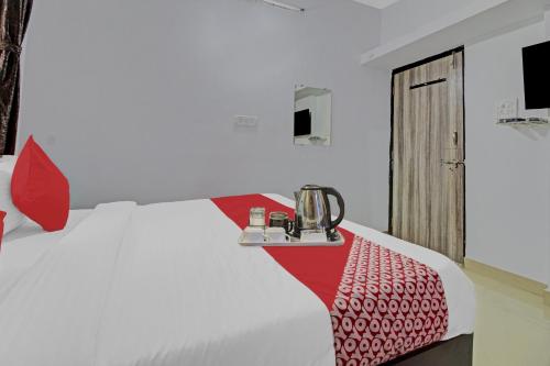 Ένα ή περισσότερα κρεβάτια σε δωμάτιο στο Hotel O Happy Stay