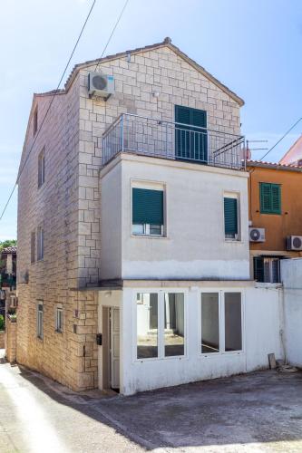 Stone house with two balconies and the sea view