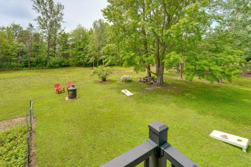 an aerial view of a yard with a tree and chairs at Quiet Country Studio Between Saugatuck and Holland! in Holland