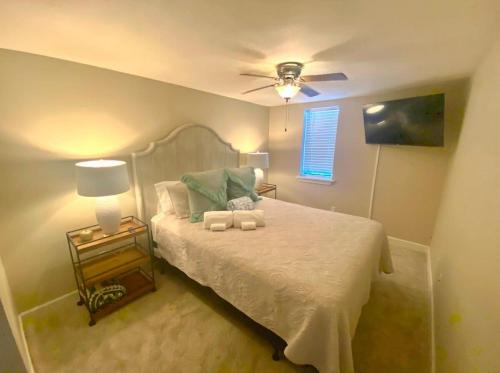 a bedroom with a bed with a ceiling fan at Red Bank Cozy Nest in Chattanooga