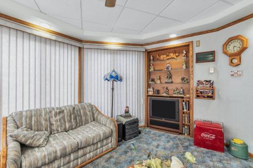a living room with a couch and a tv at Clarks Summit Gem w/ Private Yard & Parking in Newton Center