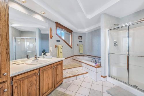 a bathroom with a tub and a sink and a shower at Clarks Summit Gem w/ Private Yard & Parking in Newton Center