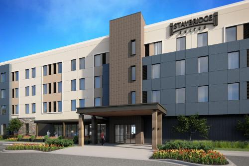 an rendering of the front of a hotel at Staybridge Suites Detroit Woodhaven by IHG in Woodhaven