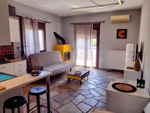 a living room with a couch and a table at MickeyHouse in Agria