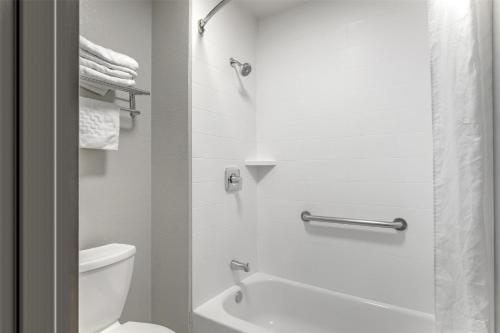 a white bathroom with a toilet and a shower at Best Western Knoxville Airport / Alcoa, TN in Alcoa