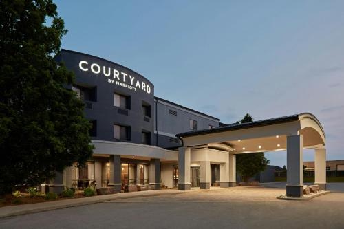 a building with a sign on the front of it at Courtyard by Marriott Hamilton in Hamilton