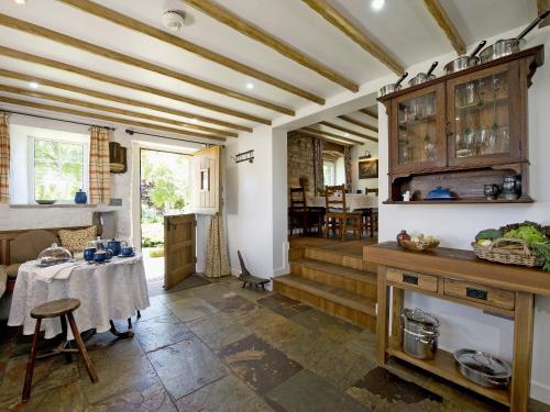a kitchen with a table and a dining room at Limber View in Glaisdale