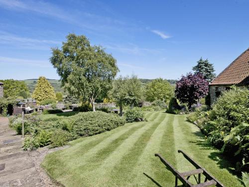 a park with a bench in the grass at Limber View in Glaisdale