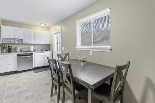 a kitchen with a dining room table and chairs at Hillside Haven - affordable and convenient in Chattanooga