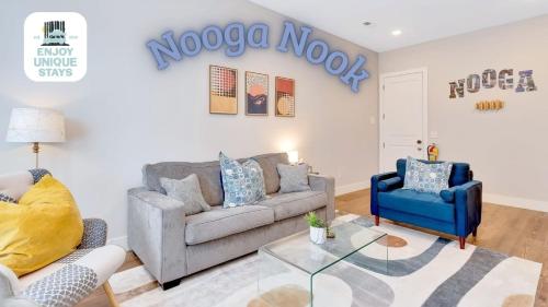 a living room with a couch and two chairs at NOOGA NOOK in Downtown Chattanooga in Chattanooga