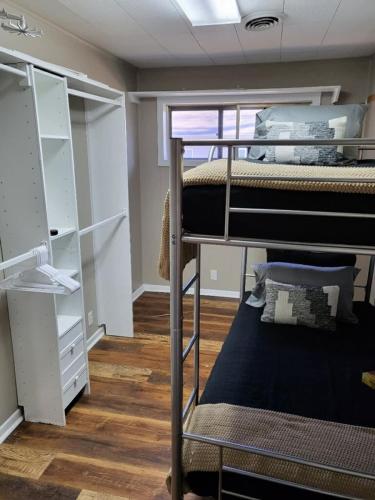 a room with two bunk beds and a closet at Pawnee 2 - Newly Renovated Duplex in Chattanooga