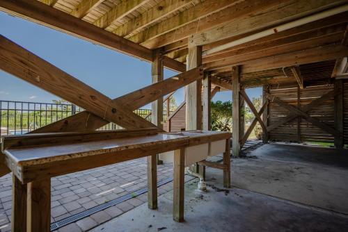 an inside view of a wooden building with a bench at Lily's Pad in Oak Island