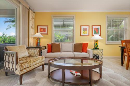 a living room with a couch and a table at Hale Pikake in Hapuna Beach