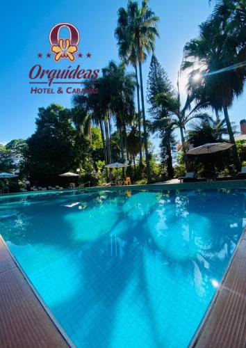a swimming pool at the olympians hotel and casino at Orquideas Hotel & Cabañas in Puerto Iguazú