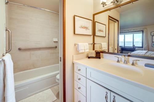 a bathroom with a sink and a tub and a shower at Water Views and Marina Access Port Ludlow Getaway in Port Ludlow