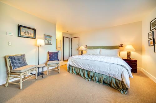 a bedroom with a large bed and a chair at Water Views and Marina Access Port Ludlow Getaway in Port Ludlow
