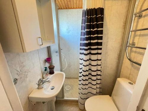 a small bathroom with a sink and a shower at 4 star holiday home in HÖLLVIKEN in Höllviken
