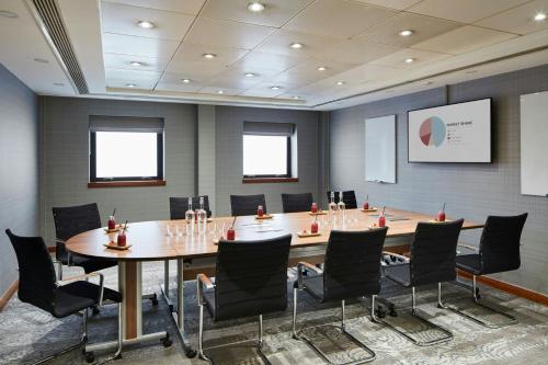 a conference room with a large table and chairs at Delta Hotels by Marriott Manchester Airport in Hale