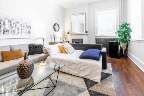 a living room with a couch and a table at Modern 1 Double bed Apartment in James South Area in Hamilton