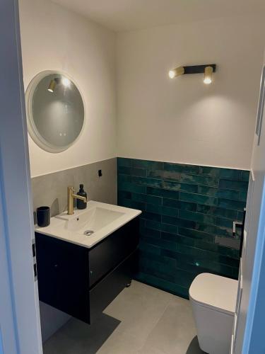 a bathroom with a sink and a toilet at Chalet in the Slovak Paradise in Hnilčík