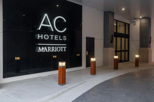 a store front of a hotel with a sign on it at AC Hotel by Marriott Wichita Downtown in Wichita