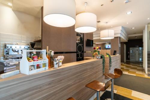 a lobby with two chairs and two lights at Hotel Majorca sul Mare in centro a Riccione con Area Fitness in Riccione