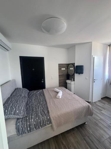 a bedroom with a large bed in a room at APARTMENTS Suzy in Tisno