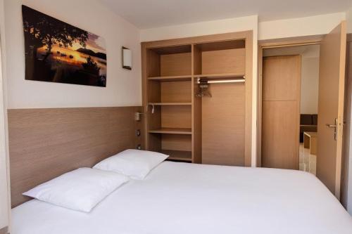 Postel nebo postele na pokoji v ubytování Résidence Paese Serenu