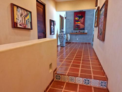 a hallway with a tiled floor in a house at Casa Tula in Cedro