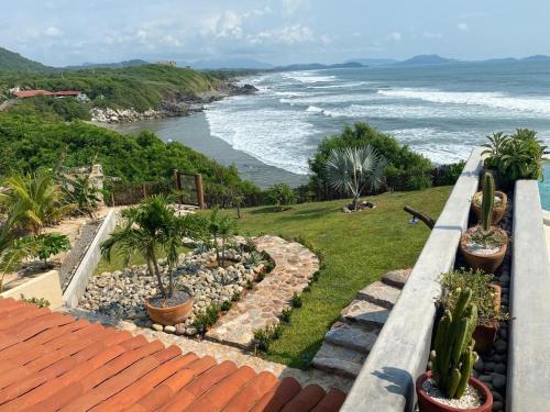 a view of the ocean from the balcony of a house at Casa Tula in Cedro