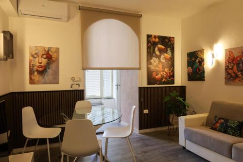 a living room with a table and a couch at Health House in Sassari