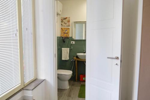 a bathroom with a toilet and a sink at Health House in Sassari