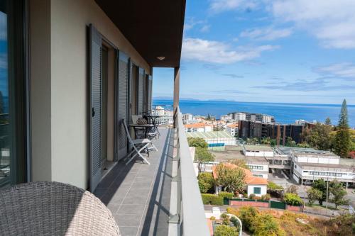 a balcony with a view of the ocean at Casa da Baía Overlooking Funchal Bay in Funchal
