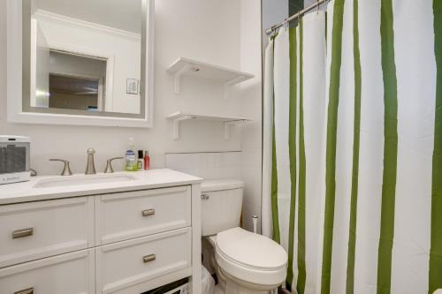 a bathroom with a toilet and a sink and a shower at 2 Mi to Arizona Christmas City! Cabin with Fireplace in Prescott