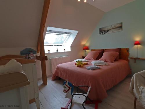 a bedroom with a bed with a red bedspread and a window at Maison ancienne avec sauna, babyfoot, billard, proche station thermale et forêt domaniale - FR-1-497-136 in La Chapelle d'Audaine