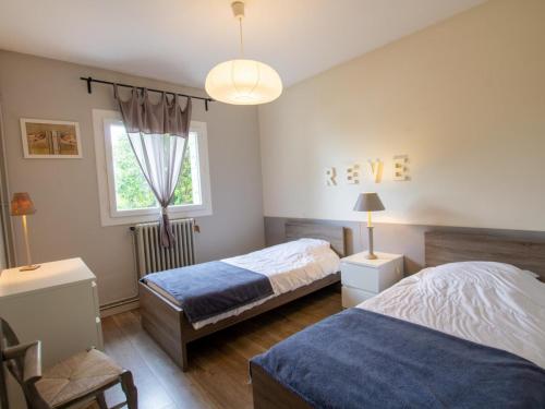 Postel nebo postele na pokoji v ubytování Maison moderne à Trélissac, 2 chambres, jardin clos, Wi-Fi, à 5 km de Périgueux - FR-1-616-74