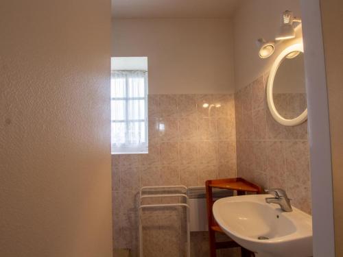 a bathroom with a sink and a mirror at Maison isolée avec Terrasse, BBQ, et Jardin - Animaux acceptés - FR-1-616-154 in Villac