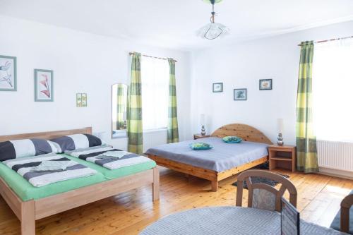 Postel nebo postele na pokoji v ubytování Penzion U Františka