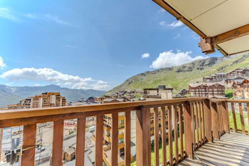 a balcony with a view of a city at 2bedroom in Heart of Val Thorens Ski-In and Parking 2 Niv in Val Thorens