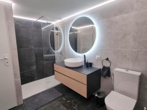 a bathroom with a sink and a mirror at Gîte chaleureux au Bessat pour 6 à 8 pers., animaux admis, grand jardin - FR-1-496-350 in Le Bessat