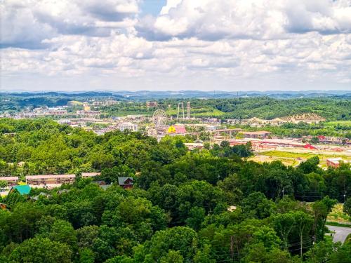 an aerial view of a city with trees at Forever Yours, 2 Hot tubs, FREE Attraction tickets, WIFI, Near The Parkway in Pigeon Forge!!! in Pigeon Forge