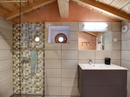 a bathroom with a sink and a shower at Gîte spacieux avec terrasse en forêt, 12 lits, proche randonnées - FR-1-496-314 in Verrières-en-Forez